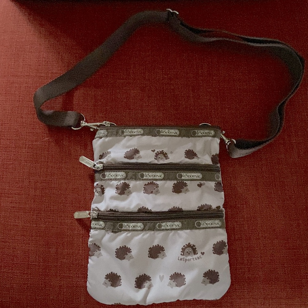Small LeSport Sac purse with 3 zipper pouches. Adorable, unique and versatile!